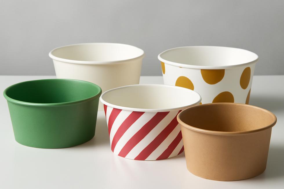A colorful assortment of large paper bowls arranged stylishly to show the variety available in the market.
